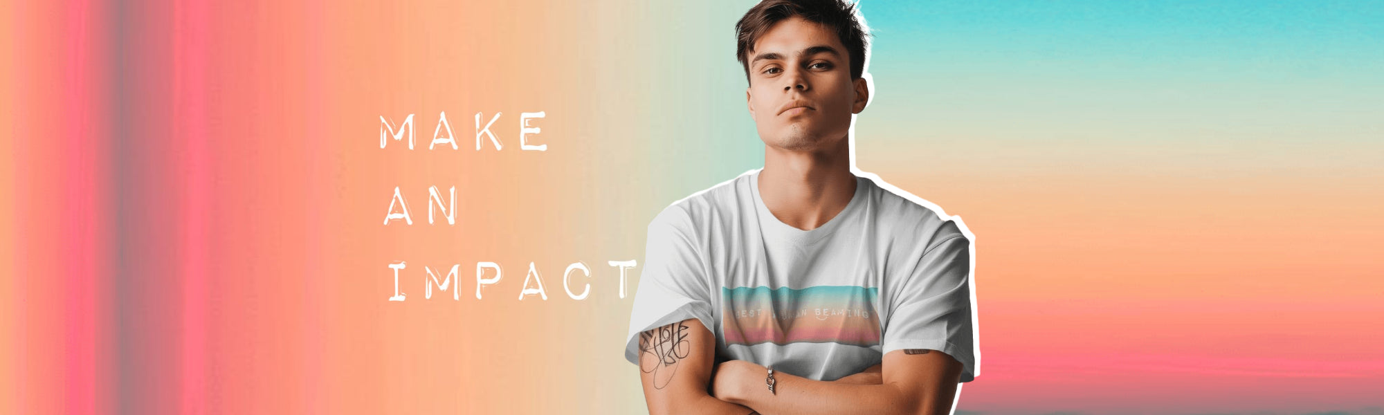 Young man in a white Best Human Beaming t-shirt with pastel ombre rectangle, standing confidently with folded arms. “Make an impact” text highlights empowerment and self-expression.