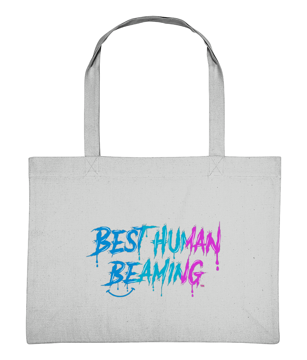 Large natural canvas tote bag with sturdy handles, displaying the “Best Human Beaming” logo in a vibrant blue and pink graffiti-style font. Sustainable, vegan tote bag crafted from recycled materials—ideal for errands, adventures, or gifting with positive energy.