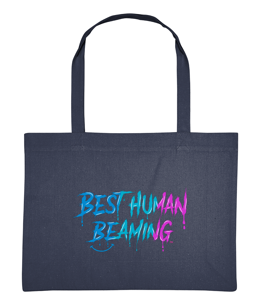 Large navy blue tote bag with long handles, printed with the “Best Human Beaming” logo in a blue-to-pink graffiti design. Eco-conscious, vegan tote bag made from recycled cotton and polyester—great for carrying essentials, spreading kindness, and sustainable living.